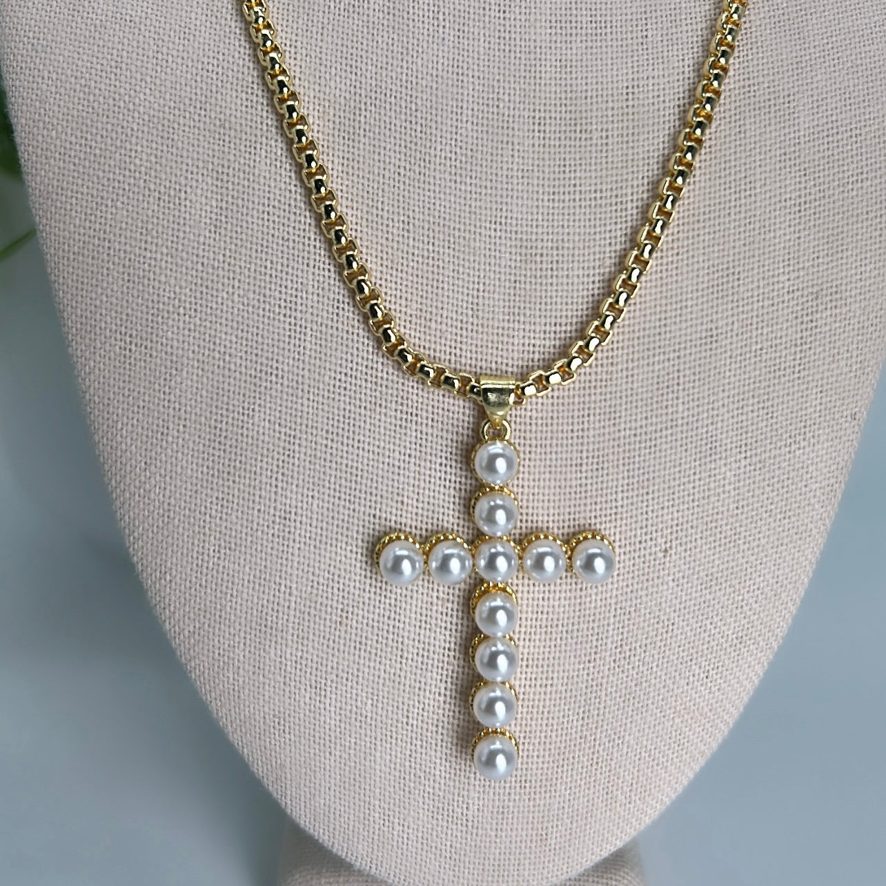 Pearl cross necklace.